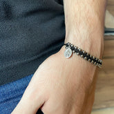 Pulsera Tejida con Balines de Acero y Medalla de la Virgen Milagrosa – VII Sacramentos Colombia
