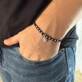 Pulsera Decenario Tejida con Medalla Plateada