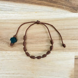 Pulsera Denario Franciscano en Hilo Marrón con Cruz de Madera sobre madera - VII Sacramentos Colombia