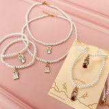 Collar y Pulsera de Perla Blanca Virgen Niña – VII Sacramentos Colombia