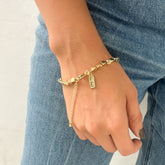 Pulsera Balín Dorado con Medalla "Fé" – VII Sacramentos Colombia