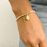 Pulsera de Perlas con Medalla de la Virgen – VII Sacramentos Colombia