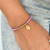 Pulsera Mostacilla con Hilo y Medalla Dorada – VII Sacramentos Colombia