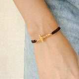 Pulsera Tejida con Cruz de San Benito en Baño de Oro