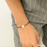 Pulsera Tejida con Medalla de San Benito en Plata Negra– VII Sacramentos Colombia