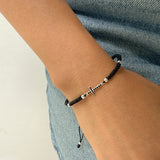 Pulsera Tejida con Cruz Negra y Balines en Plata 925 – VII Sacramentos Colombia