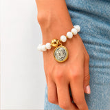 Pulsera Balín Dorado Murano Blanco con Medalla Sagrada Familia