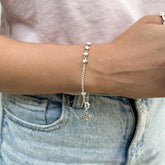 Pulsera Denario Corazones Resinados Blanco – VII Sacramentos Colombia