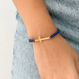 Pulsera Tejida con Cruz en Acero Dorado