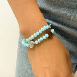 Pulsera rosario elástica doble vuelta en cristal de murano azul con cruz de madera y medallas de santos en zamak, talla S - VII Sacramentos