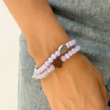Pulsera rosario elástica doble vuelta en cristal de murano morado con cruz de madera y medallas de santos en zamak, talla S - VII Sacramentos