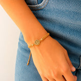 Pulsera Macramé Hilo Beige con Medalla San Benito Oro Laminado