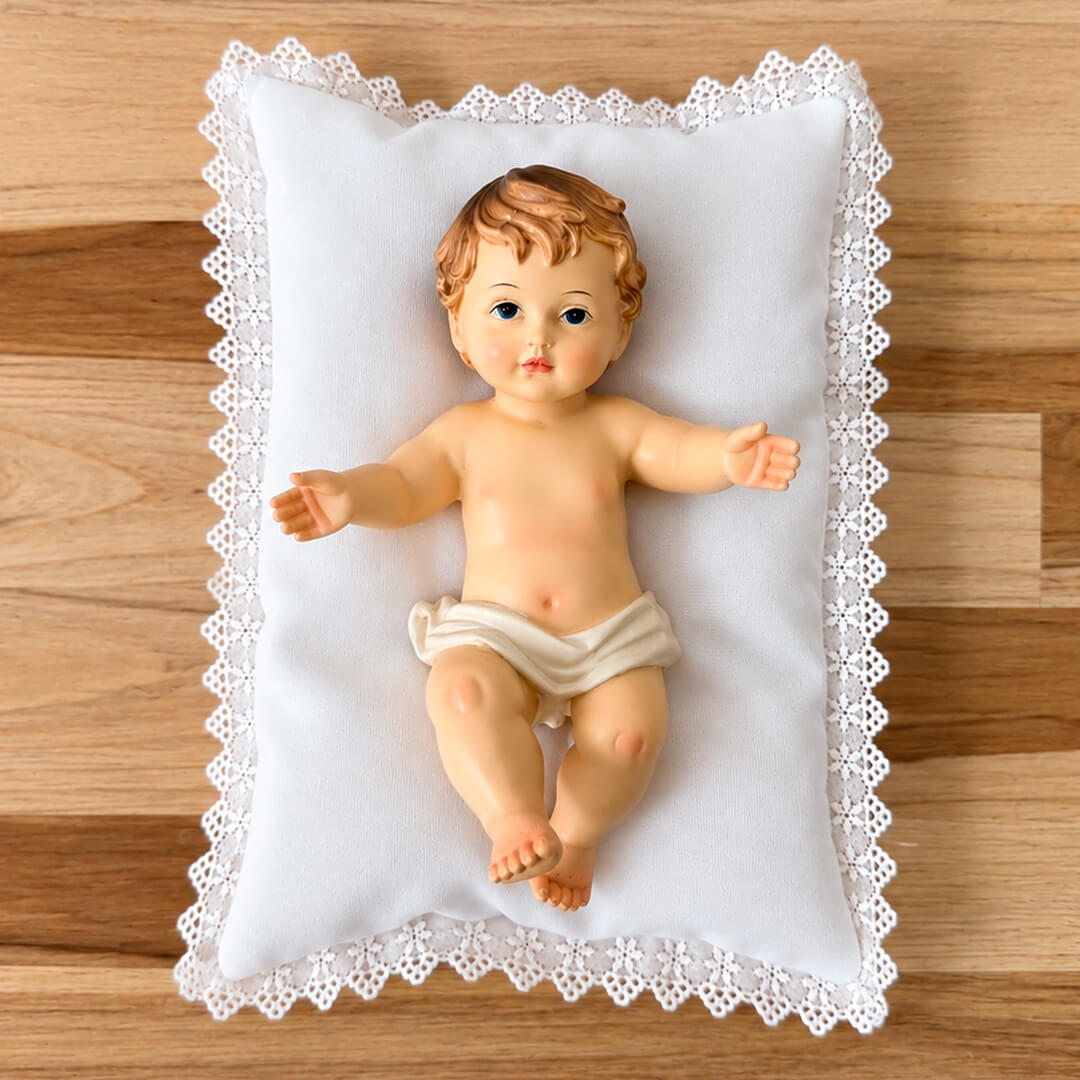Estatua Imagen del Niño Jesús de 20cm acostado sobre un colchon o cojin 